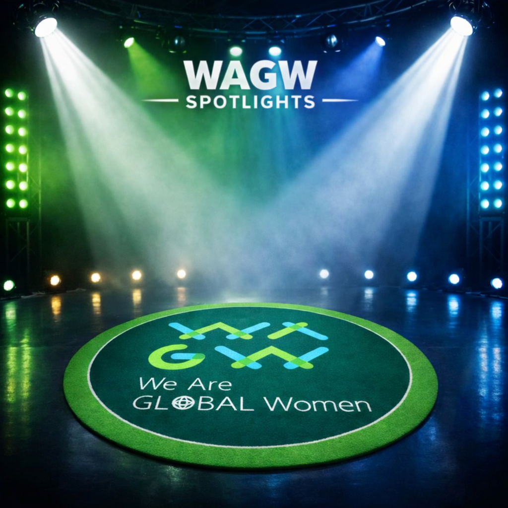 Stage with spotlights and 'WAGW SPOTLIGHTS' branding, featuring a circular mat with 'We Are Global Women' text.